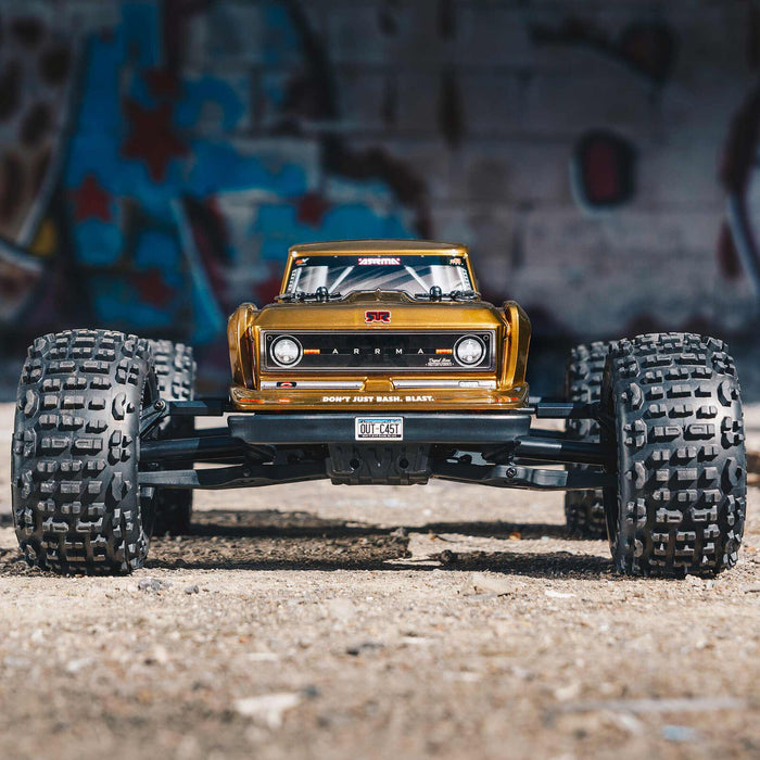 ARRMA ARA4410V2T1 1/10 OUTCAST 4x4 4S BLX Brushless Stunt Truck - Bronze