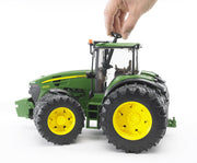 Playing with a Bruder John Deere tractor